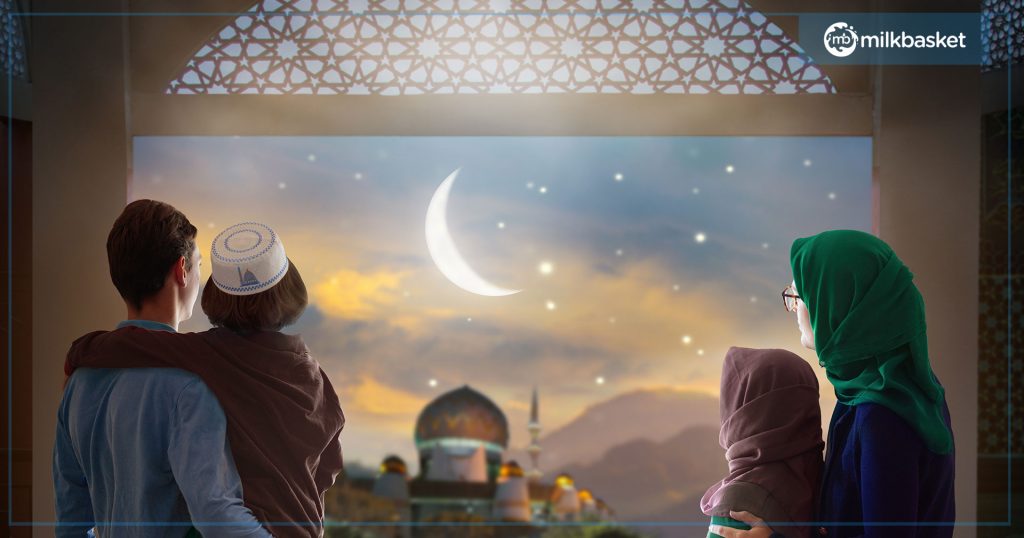 Family looking out at the Eid moon and night sky