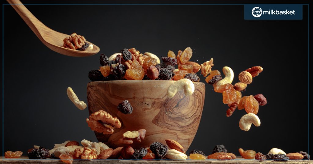 Dry fruits being poured in a bowl
