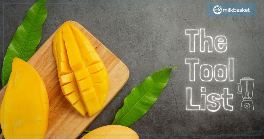 mango cut and sliced on a wooden chopping board