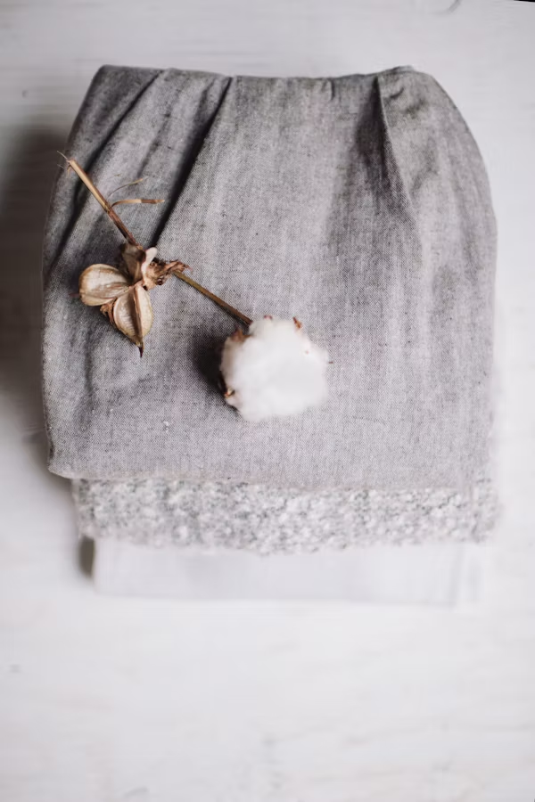 Image of a cotton clothe, representing that one should wear breathable clothes to help your skin breathe.