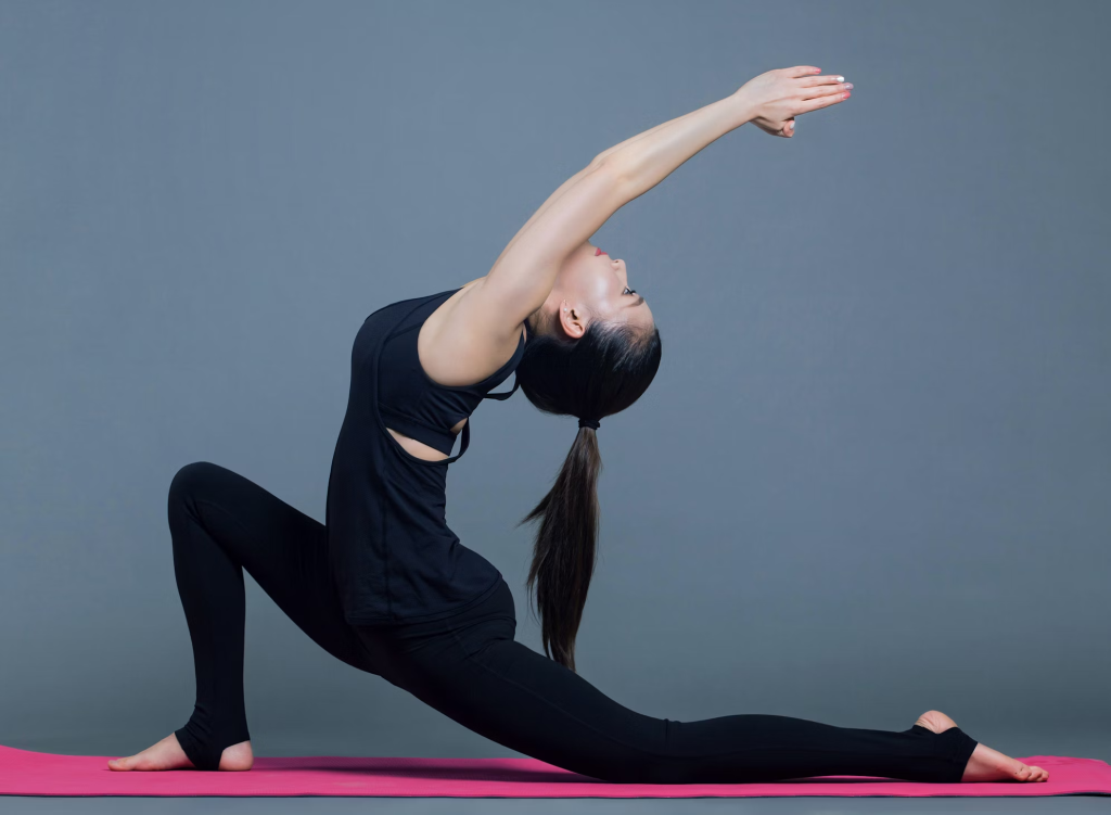 A girl in black yoga dress is doing hatha yoga on the international yoga day