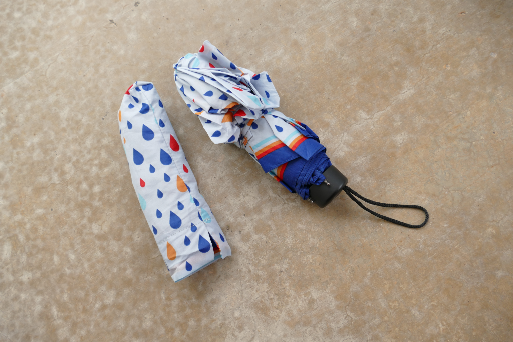 foldable umbrella kept on a soft surface