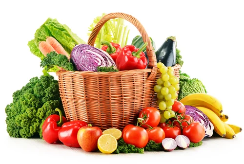 A colorful basket filled with fresh vegetables, including lettuce, cabbage, carrots, tomatoes, and bananas, ideal for preparing fasting meals for Janmashtami 2024.