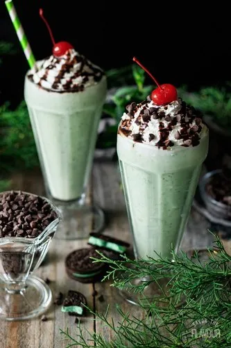 Mint chocolate chip milkshake recipe with whipped cream, chocolate drizzle, and a cherry, great for mint lovers looking for a refreshing twist.