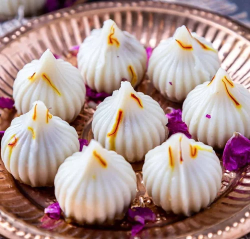 Delicious modaks, a Ganesh Chaturthi essential puja item and favorite sweet offering for Lord Ganesha.